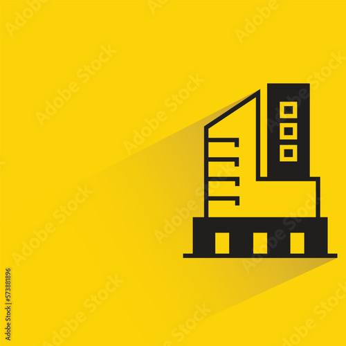 office building with shadow on yellow background