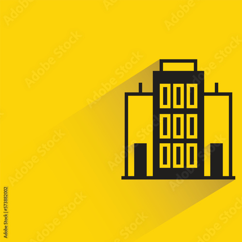office building with shadow on yellow background