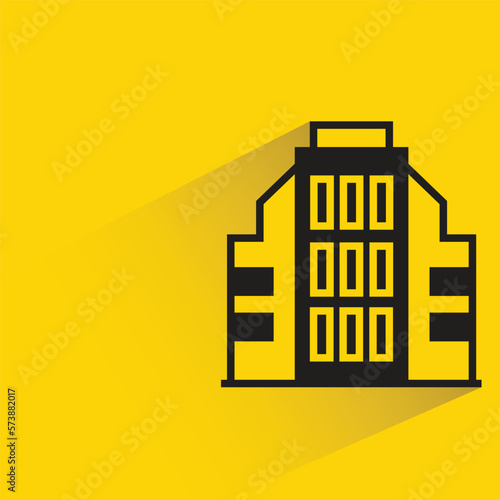 office building with shadow on yellow background