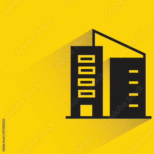 office building with shadow on yellow background