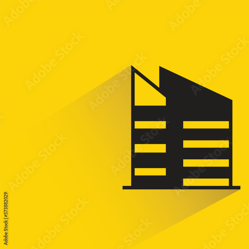 office building with shadow on yellow background