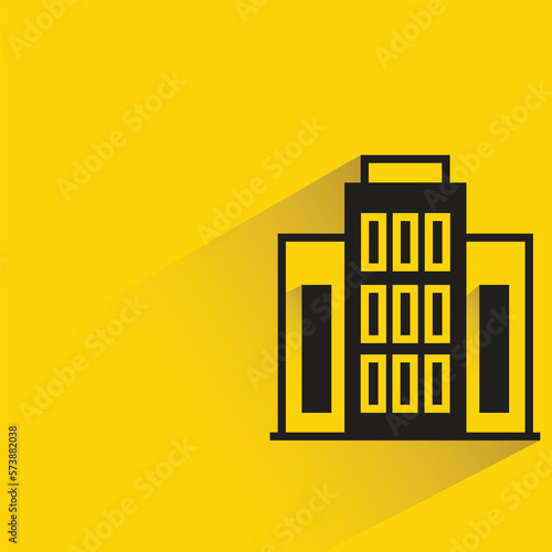 office building with shadow on yellow background