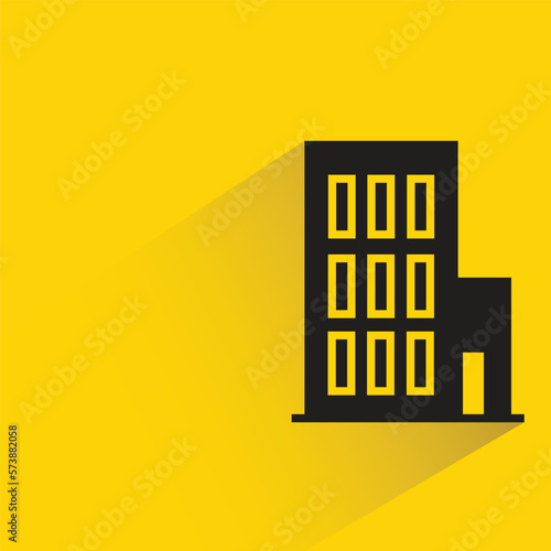 office building with shadow on yellow background