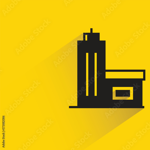 office building with shadow on yellow background