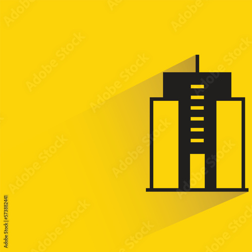 office building with shadow on yellow background