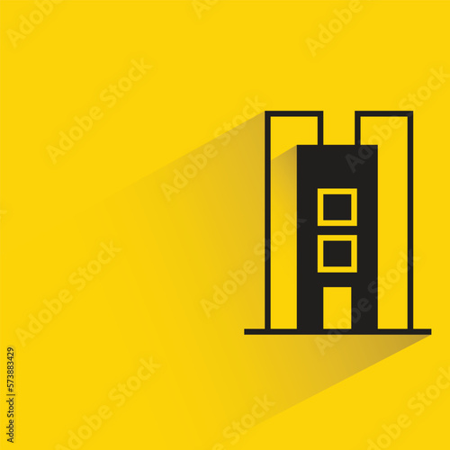 office building with shadow on yellow background