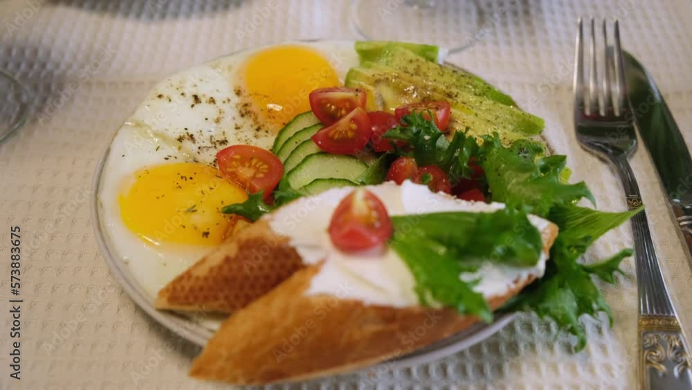 breakfast of eggs, avocado, lettuce, cherry tomatoes and baguette breakfast of eggs, avocado, lettuce, cherry tomatoes and baguette