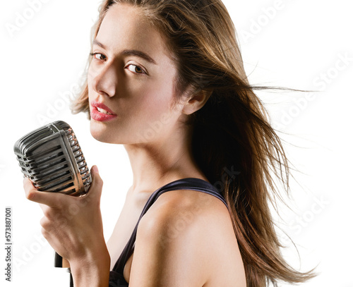 Beautiful young female singer with vintage microphone