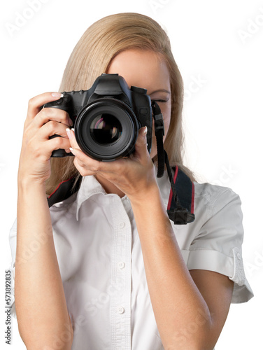Woman taking photographs with a DSLR