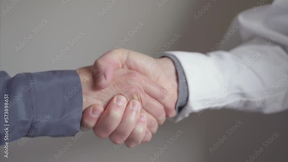doctor patient trust bond concept. Confidentiality. Female patient and male doctor shake hands