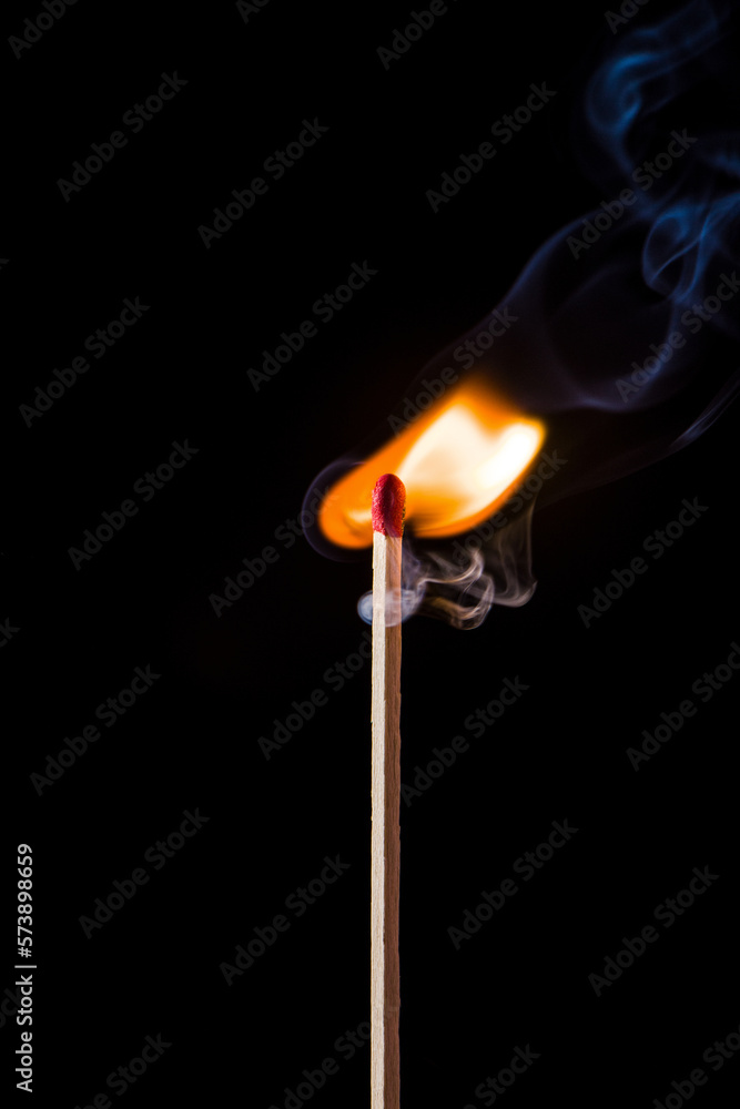 Lighting matches at the moment when it explodes. Burning match on black background. Lighting matches at the moment when it explodes. Burning match on black background.