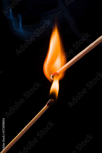 the moment two matches catch fire,burning matches.