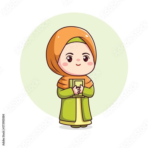 Cute hijab girl holding alqur’an photo