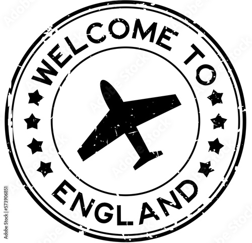 Grunge black welcome to england with airplane icon round rubber seal stamp on white background