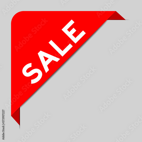 Red color of corner label banner with word sale on gray background