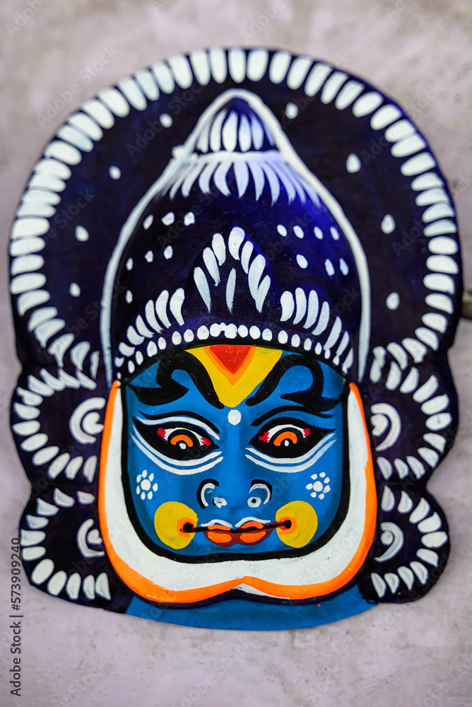 Beautiful handmade mask displayed in a shop for sale in blurred background. Indian handicraft. Beautiful handmade mask displayed in a shop for sale in blurred background. Indian handicraft.