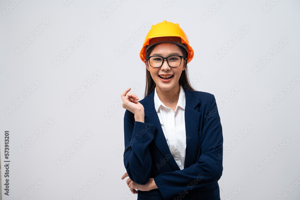 Portrait of Asian female engineer with hard hat isolated on grey background. Portrait of Asian female engineer with hard hat isolated on grey background.