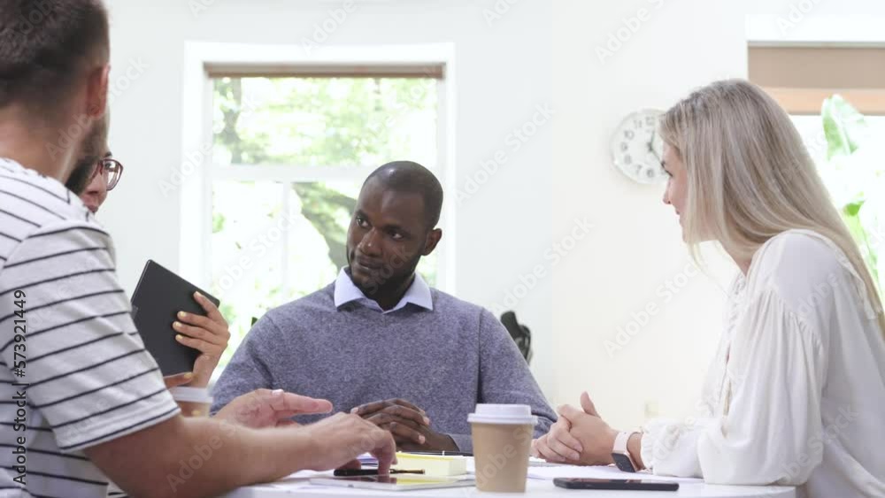 Business multi-ethnic team working together in a meeting. Business multi-ethnic team working together in a meeting.
