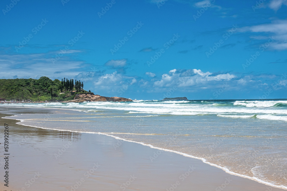 Joaquina beach with stone and dunes in Florianopolis, Santa Catarina, Brasil.