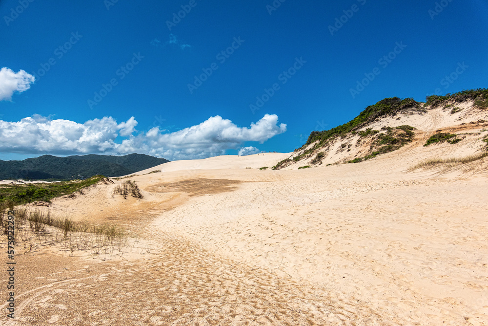 Joaquina beach with stone and dunes in Florianopolis, Santa Catarina, Brasil. Joaquina beach with stone and dunes in Florianopolis, Santa Catarina, Brasil.
