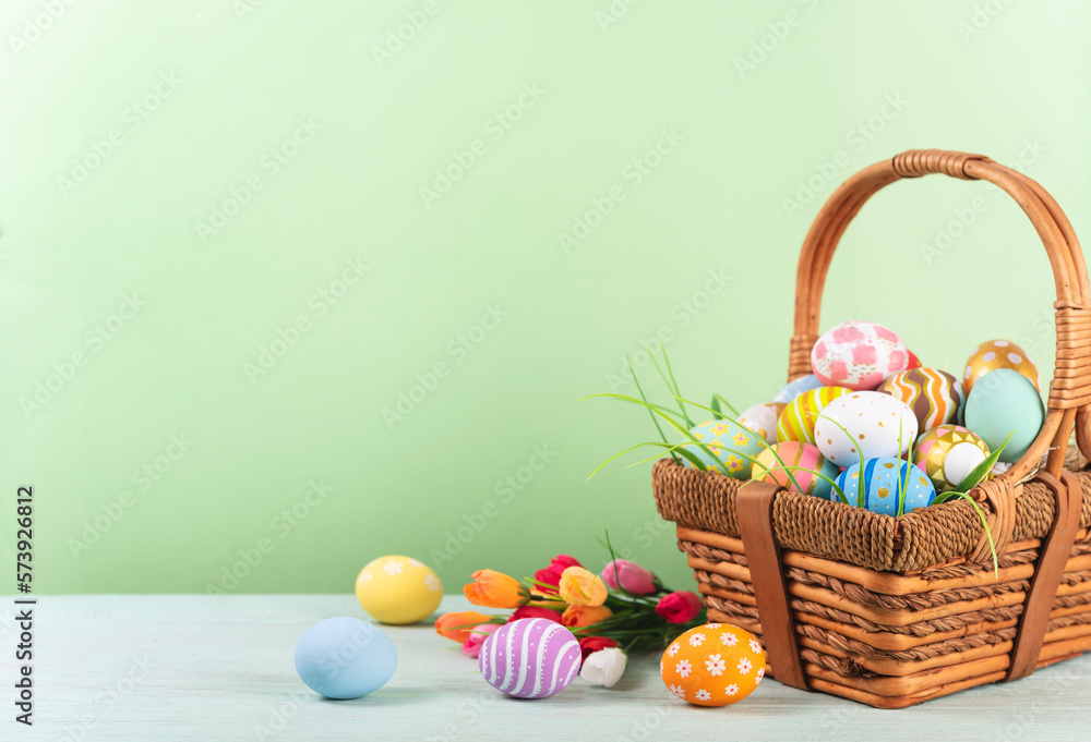Happy easter, Easter painted eggs in the basket on wooden rustic table for your decoration in holiday. copy space. Happy easter, Easter painted eggs in the basket on wooden rustic table for your decoration in holiday. copy space.