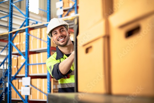 Industrial african worker man black in factory, worker working in warehouse stock checking with froklift. suppervisor team control and management. Business factory industry teamwork concept.