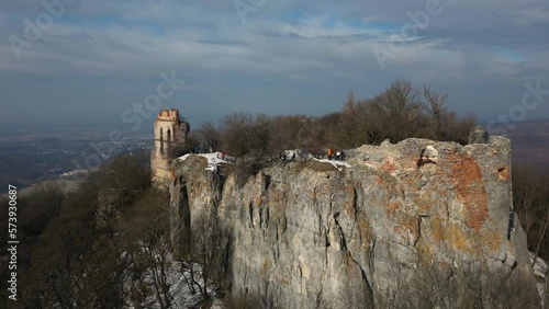 Lots of tourists on top of a cliff with ruins of Pajstun Castle, Slovakia, 4k photo