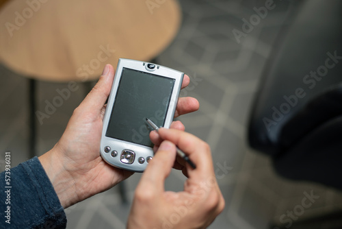 Obraz na plátně Old school PDA device with stylus from early 2000s and millennium