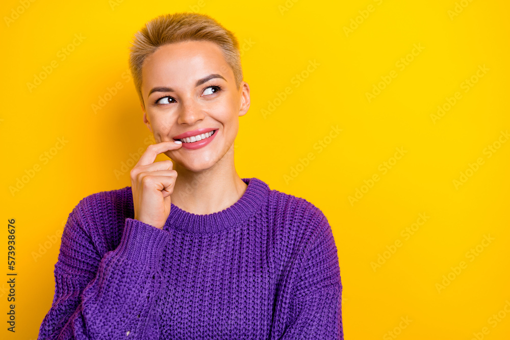 Photo of smiling short blonde hair adorable lady wear knitted purple pullover bite finger minded look mockup isolated on yellow color background