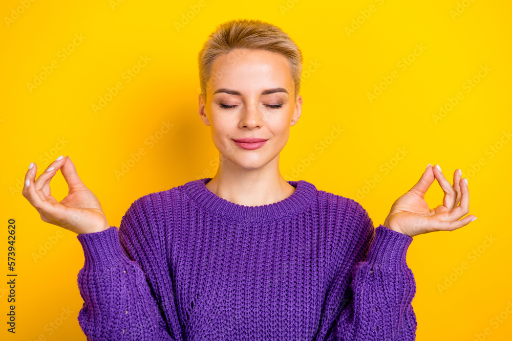 Portrait of lovely cute lady calm face expression free time hobby hands demonstrate yoga symbol isolated on yellow color background Portrait of lovely cute lady calm face expression free time hobby hands demonstrate yoga symbol isolated on yellow color background
