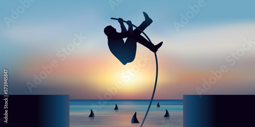 Concept de l’audace et de la prise de risque dans le monde des affaires, avec un homme qui franchit un obstacle en sautant à la perche. photo