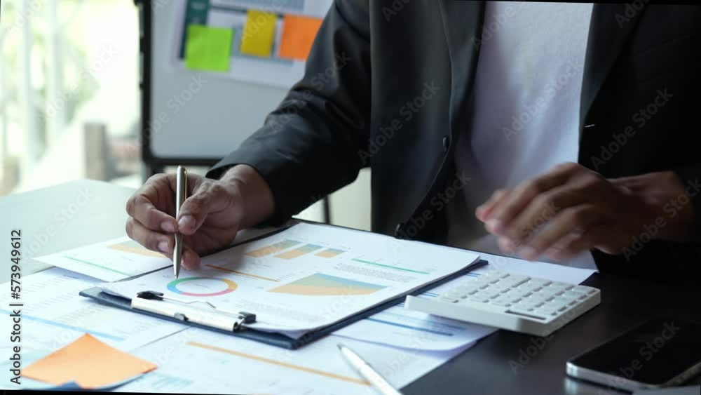 Businessman analyzing corporate profit graph document. Taxation. To account for the company's income and expenses.
Businessman analyzing corporate profit graph document. Taxation. To account for the company's income and expenses.