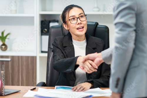 success business woman admire good employee. successful office boss thumbs up to respectful worker to have client contract for meeting. worker offer manager customer offer for company to negotiation photo