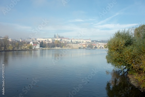 Panorama of Prague capital city in morning fog with Vltava and Prague Castle