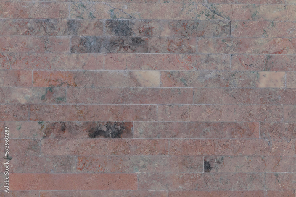 Fototapeta premium Dusty dark pink brick marble wall, close up.