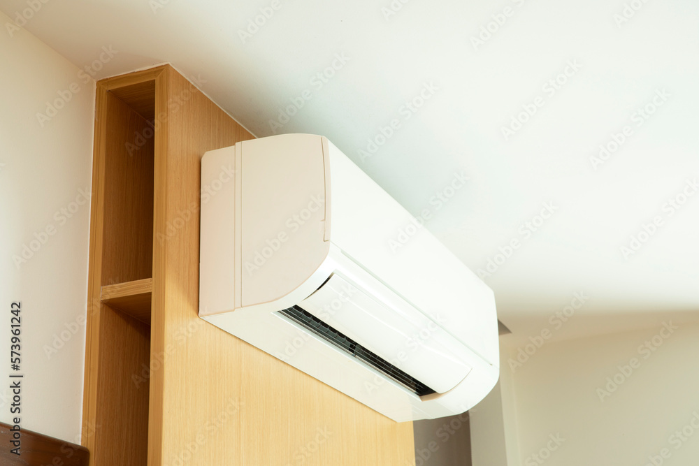 Fototapeta premium Split air conditioner installed on wooden wall.