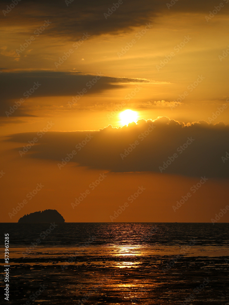 orange sunset over the small island