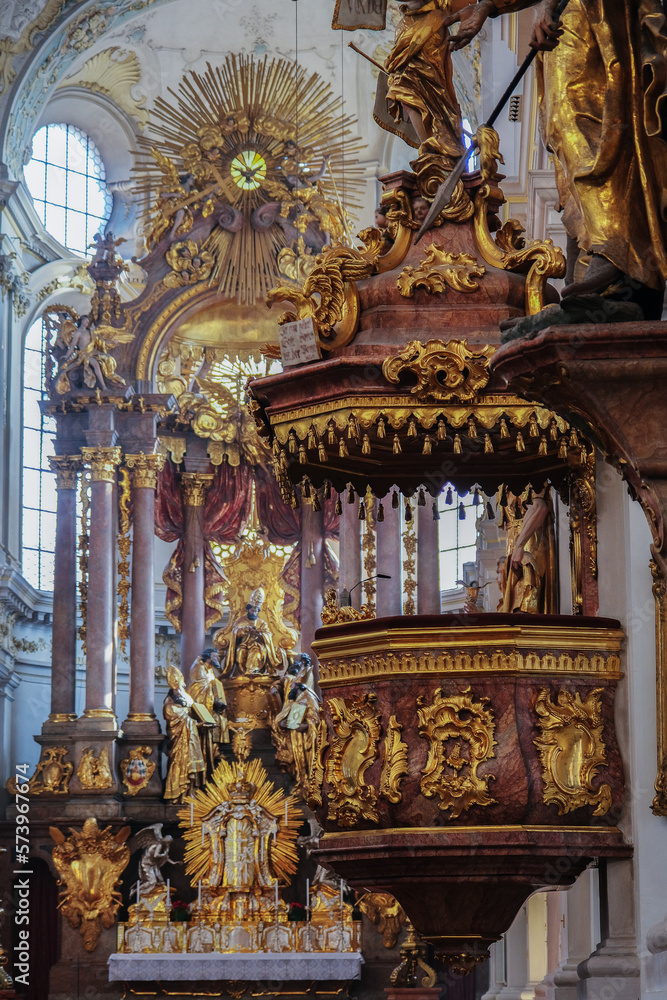 Obraz premium Magnificent opulent splendid Bavarian baroque church cathedral basilica interiors with stucco, murals, altar, Pilars, ceiling paintings, gold, wood domes nave