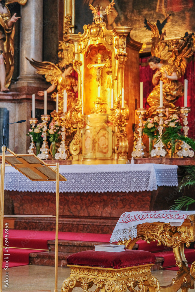 Magnificent opulent splendid Bavarian baroque church cathedral basilica interiors with stucco, murals, altar, Pilars, ceiling paintings, gold, wood domes nave