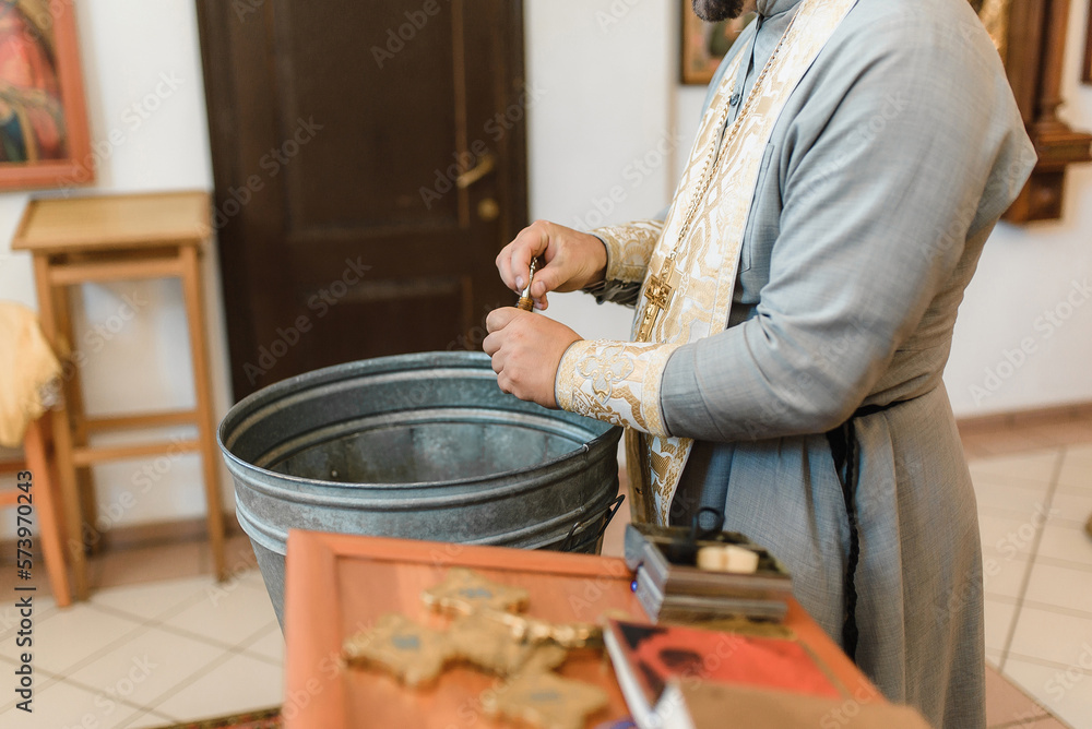 Font with water for baptism in Orthodoxy. Christian ritual of the ...