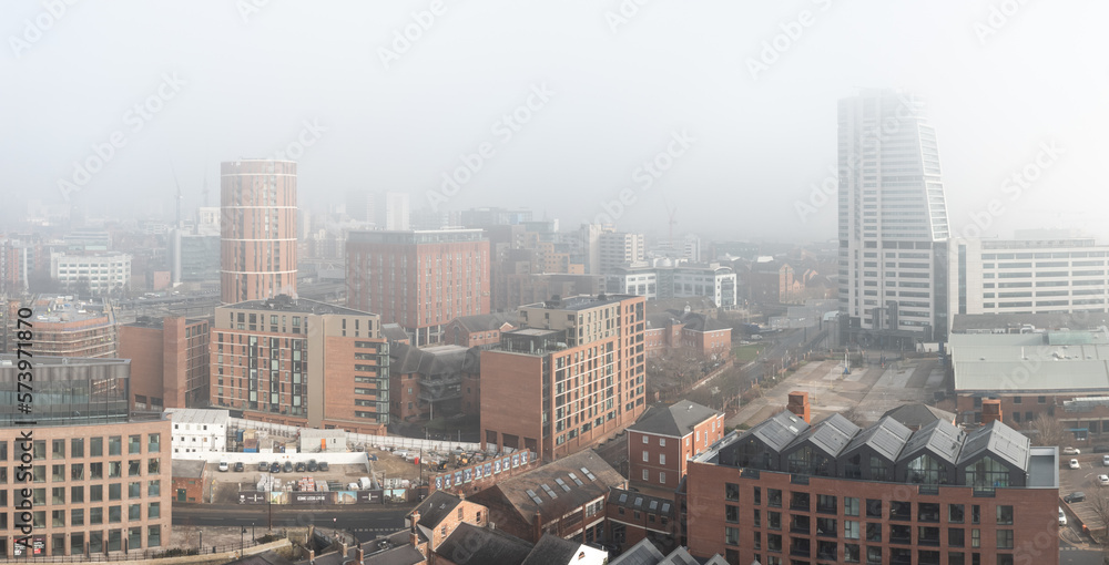 Aerial panorama of Leeds cityscape skyline in fog and mist