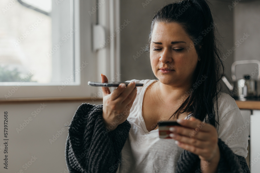 Caucasian woman is checking her bank account information Caucasian woman is checking her bank account information