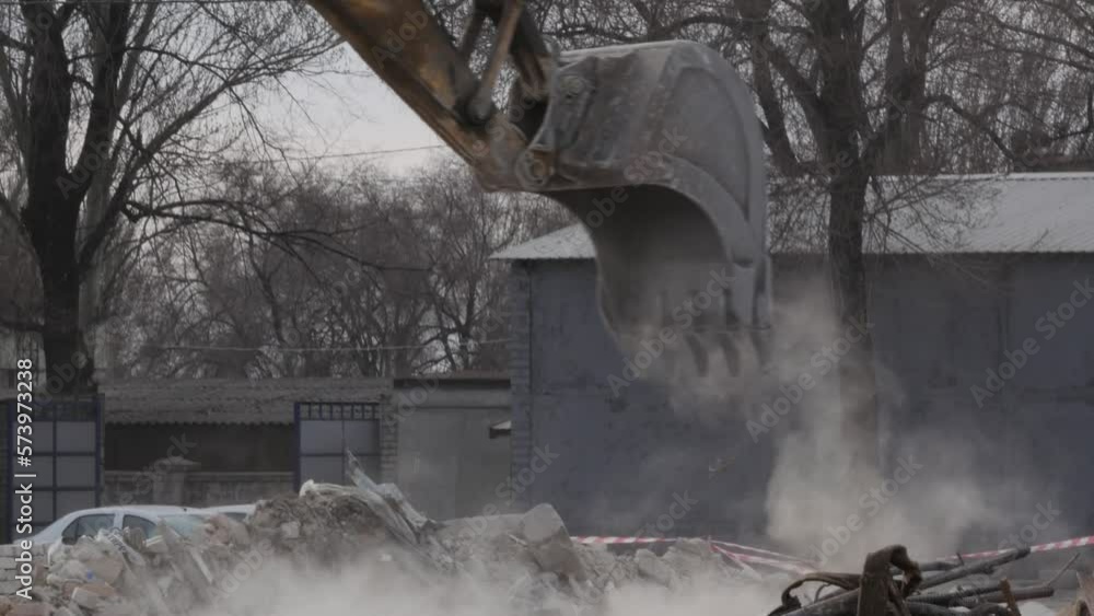 Closeup of bucket Excavator working to get rid of the rubbish in a