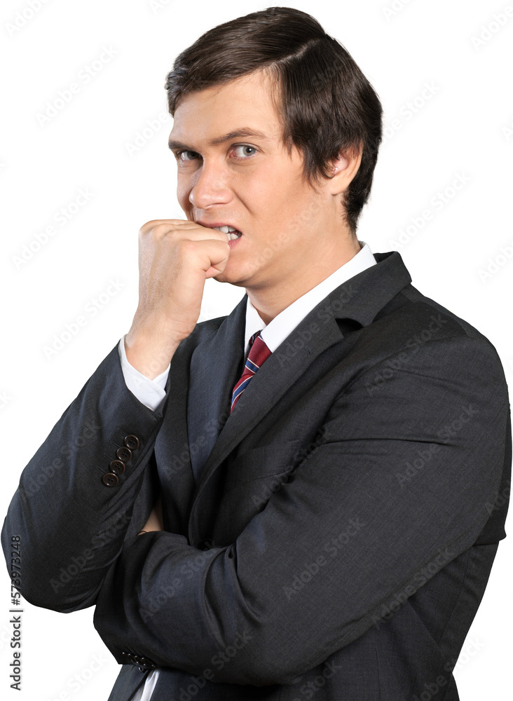 Stressed businessman biting his fist Stressed businessman biting his fist