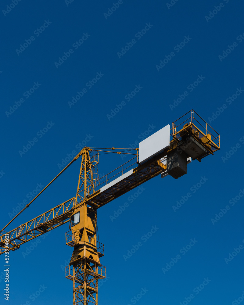 construction yellow crane on blue background construction yellow crane on blue background