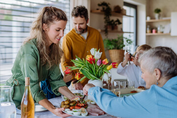 Happy multigenertional family having Easter dinner together.