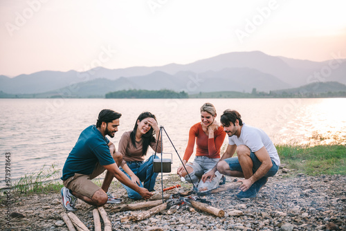 Happy friends meeting at campground, Group of diverse people enjoy camping with friends at campyard on vacation