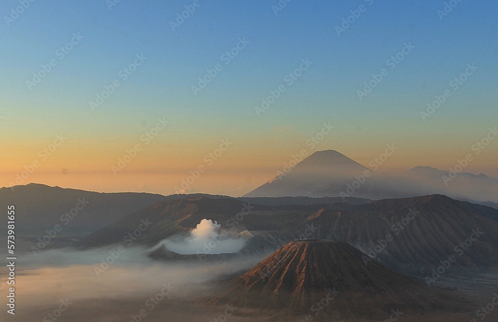 view of the crater of Mount Bromo with Mount Semeru in the background
