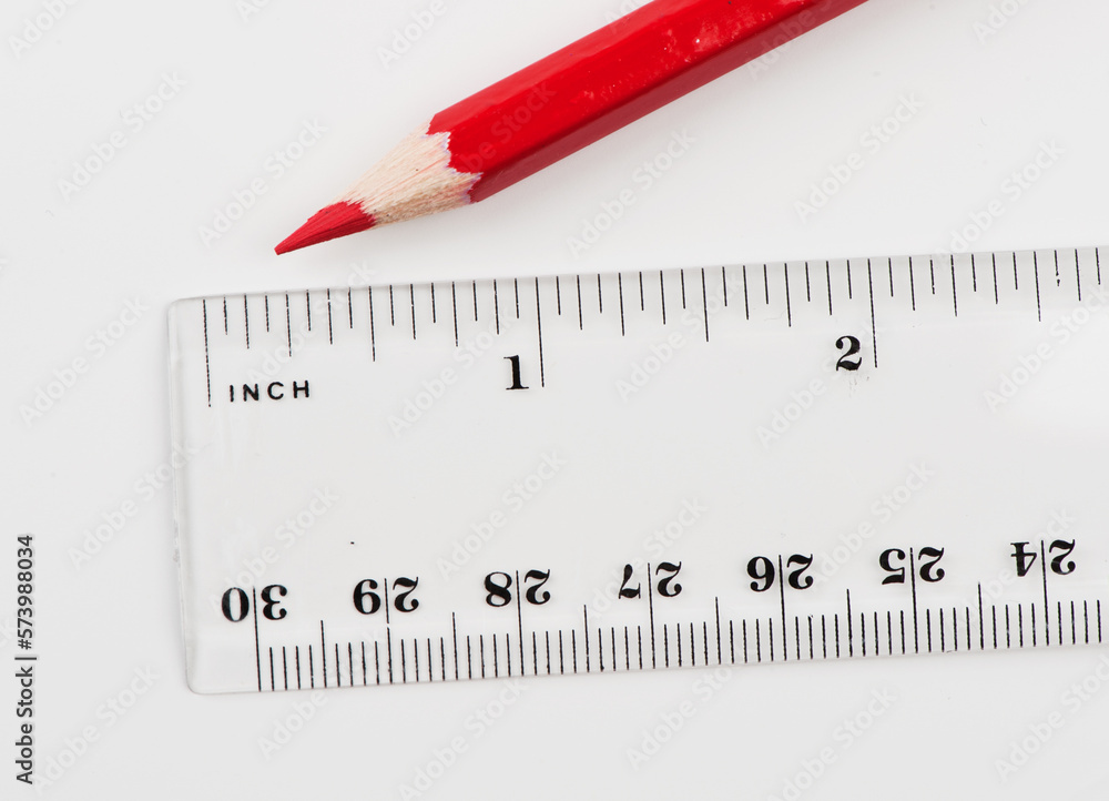 Transparent plastic ruler and red wooden pencil Transparent plastic ruler and red wooden pencil