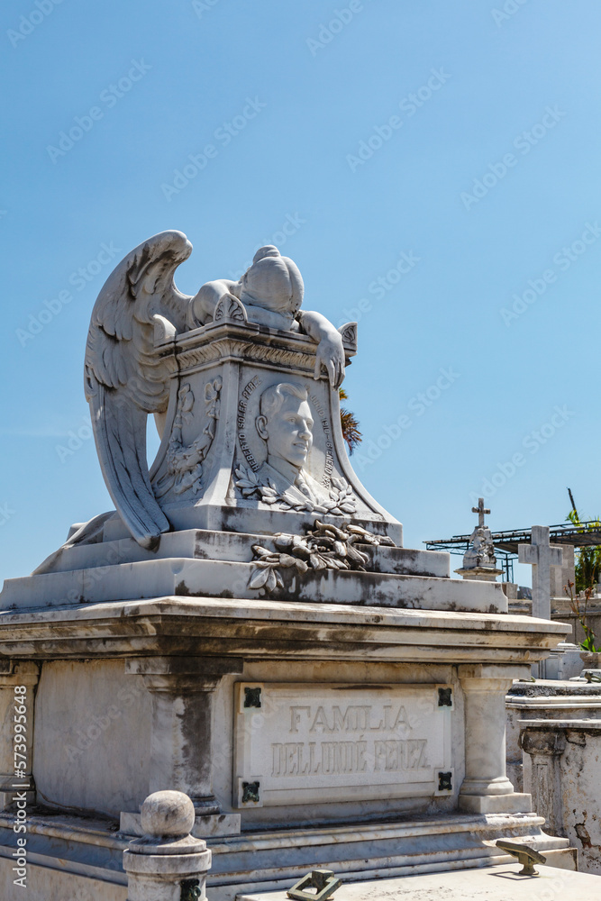 Obraz premium Rich decorated grave with a mourning angel statue at the Santa Ifigenia Cemetery in Santiago de Cuba, Cuba, Caribbean
